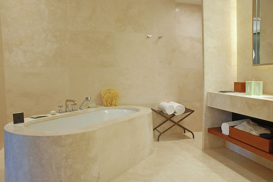 curved travertine tub deck